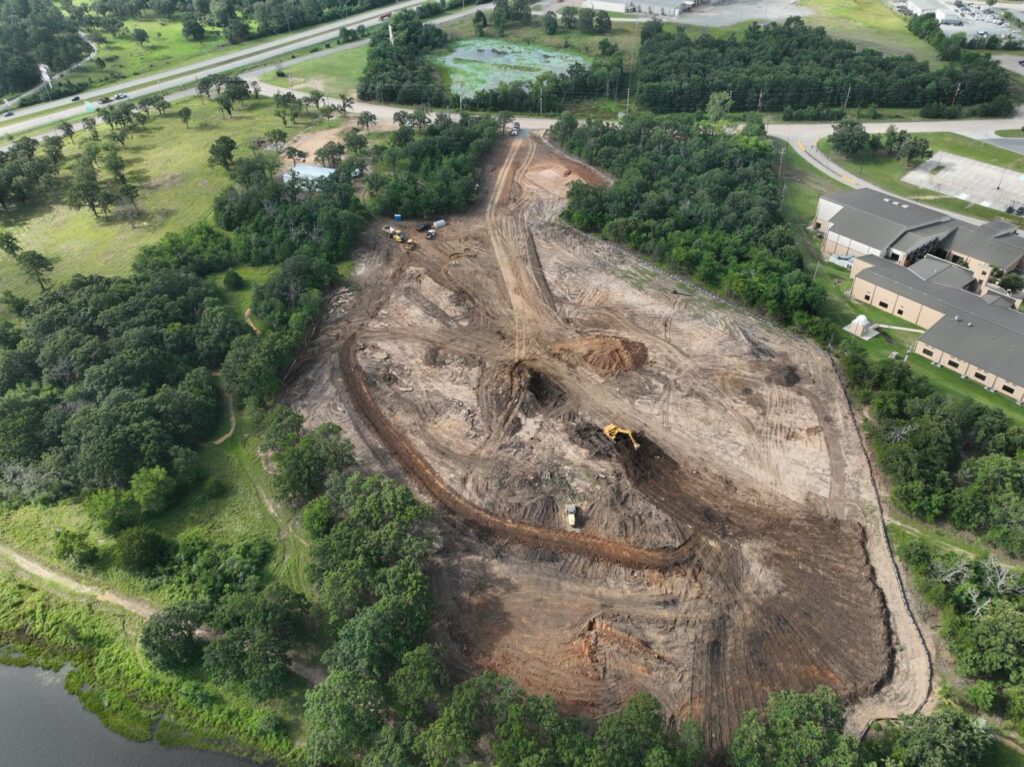 Aerial view of early site clearing at the Caring Hands site, June 2026